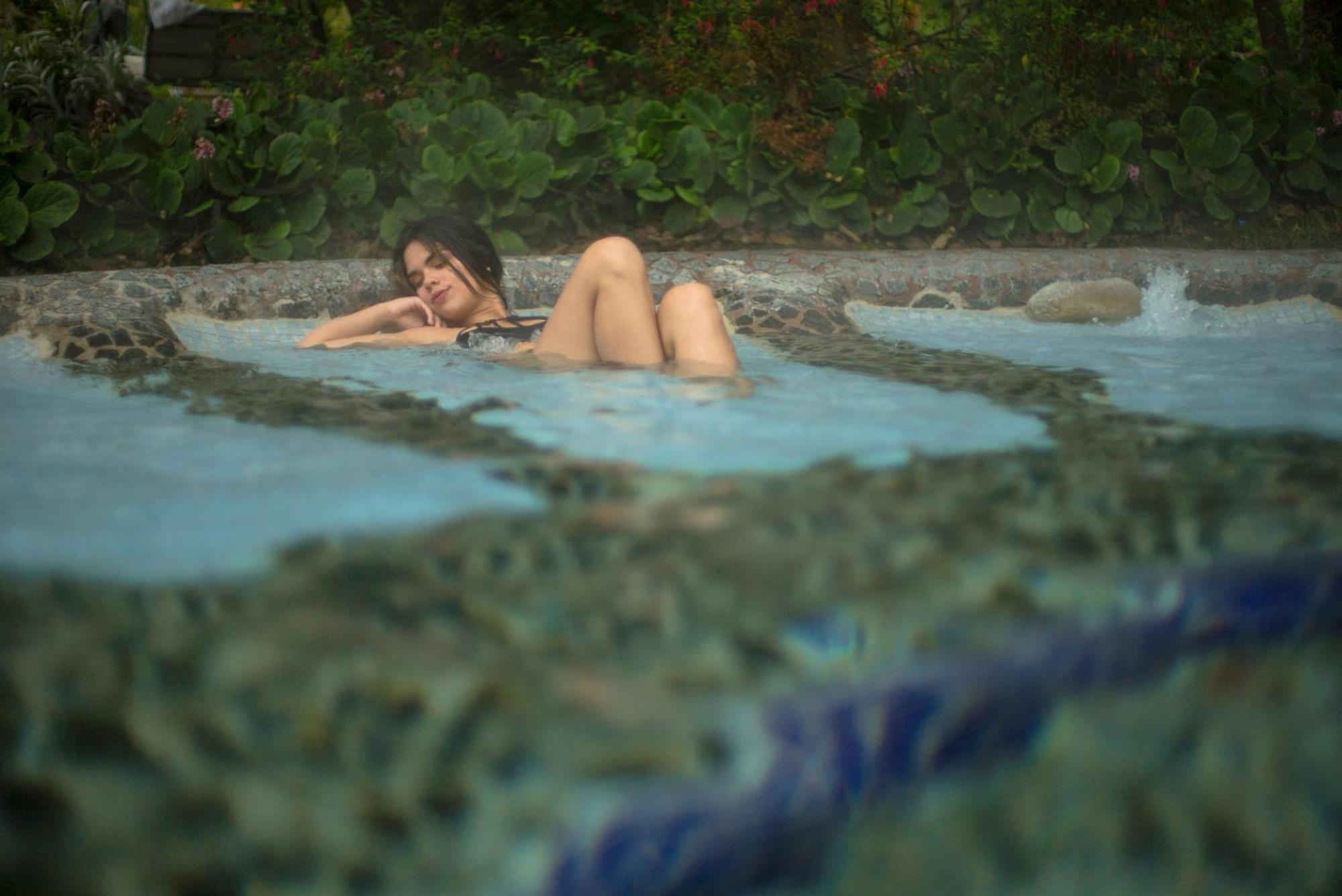 Termas De Papallacta Exterior photo A woman bathing in the hot springs